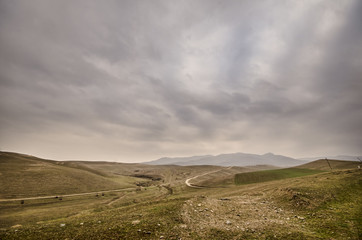 Majestic sunset in the mountains landscape. Dramatic sky clouds. Azerbaijan, Gazakh Big Caucasus