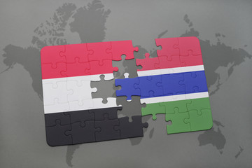 puzzle with the national flag of yemen and gambia on a world map