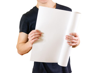 Guy holds in his hands twisted up in paper. Opens the package of paper. Shows a blank sheet rolled...