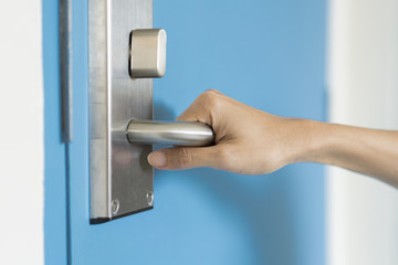 hand hold handle of door, close up