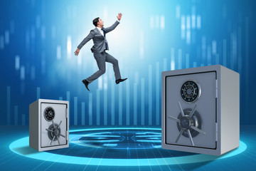 Businessman jumping from safes in business concept