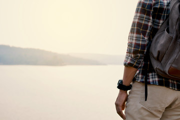 Happy Asian hipster man backpack in nature background, Relax time on holiday concept travel , color of vintage tone and soft focus