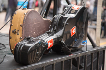 Two guitar cases concert site stage