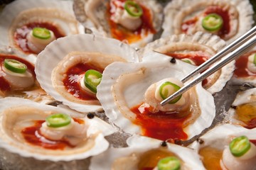 Sliced Raw Scallops with red chili pepper sauce