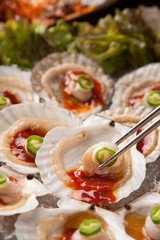 Sliced Raw Scallops with red chili pepper sauce