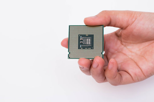 Hand holding CPU computer