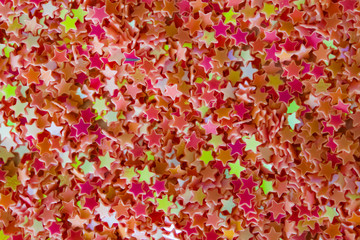 Abstract background of brightly colored plastic stars