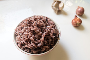 Bowl with cooked white berry rice