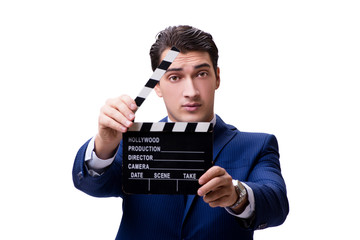 Handsome man with movie clapper isolated on white