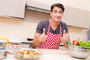 Man male cook preparing food in kitchen