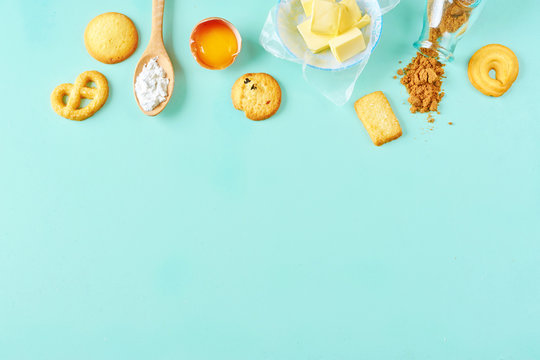 Making pastry concept with baking tools and ingredients on a modern  concrete background with copy space. Wooden scoops, whisks, cookie cutters,  muffin tin, sugar, flour, anise stars from above Stock Photo 