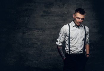 A man with a tattoo on his face and arms.