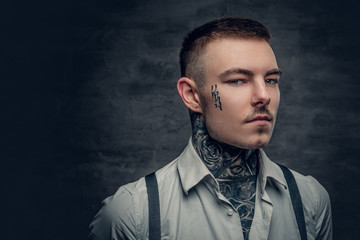 A man wearing white shirt and suspenders.