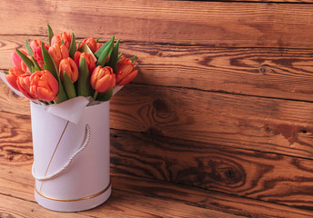 beautiful fresh spring tulips in a box with copy space