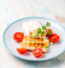 sandwich with cut tomatoes nearby, topview