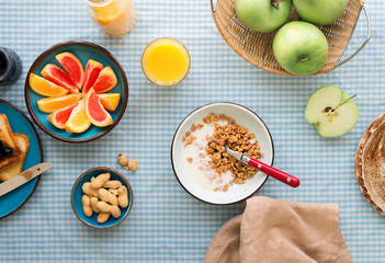 Bowl of muesli with yogurt on table. Healthy breakfast table