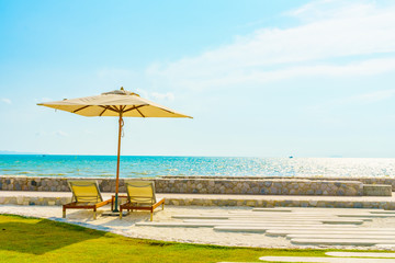 Umbrella and chair with sea view