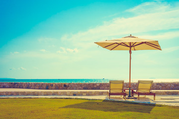 Umbrella and chair with sea view