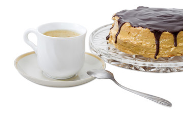 Coffee with cream on a background of a sponge cake