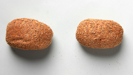 Different kinds of bread on background