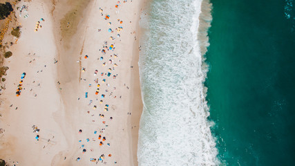 Fototapeta na wymiar Beach shore umbrellas from above