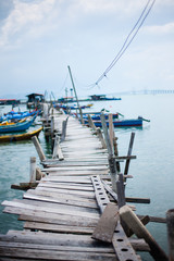 Fototapeta premium Wooden pier on the sea background