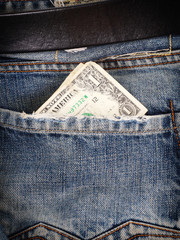 Dollar in pocket jeans