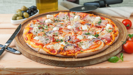 Thick greece pizza on a wooden tray