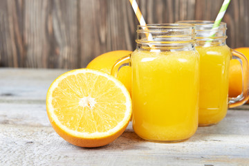 Naklejka na ściany i meble Glass of orange juice and orange fruit