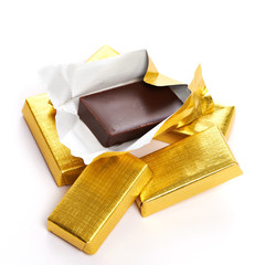 Chocolate in gold wrappers isolated