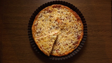 home made hot pizza on wooden table