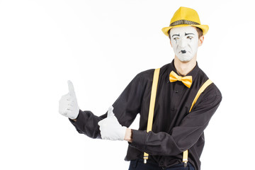 Portrait of a man, an artist, a pantomime. Shows something, isolated on white background