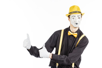 Portrait of a man, an artist, a pantomime. Shows something, isolated on white background