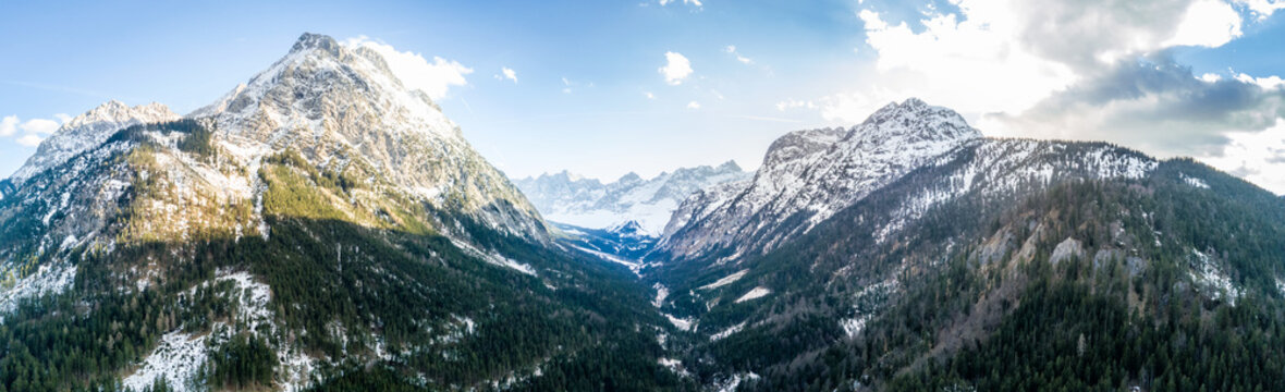 Alpine mountain with panorama view into a valley. Shot with a drone in the Karwendel mountain range
