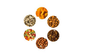 nuts and dried fruit in circles on a white background