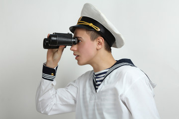 sailor looking through binoculars
