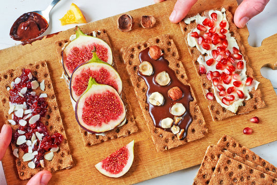 Healthy snacks for party: assorted sandwiches on rye crisp with different toppings