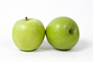 Sliced green apple isolated on white background