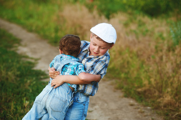 Fototapeta premium Brother and sister on a walk in the fresh air.