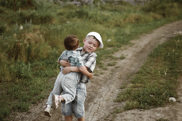 Fototapeta premium Brother and sister on a walk in the fresh air.