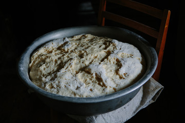 Making dough by female hands at home