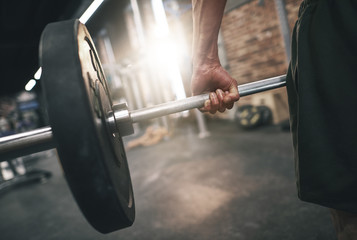 Close up of man practicing deadlifts