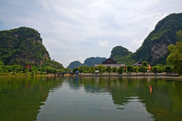 Fototapeta na wymiar Tourist boat on terrestrial halong bay, Trang An, Ninh Binh, Vietnam