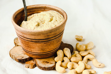 Cashew sauce for salad, raw vegan cheese from nuts with nutritional yeast