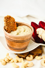 Cashew sauce, diary free cheese from nuts with carrot crackers and vegetables