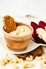 Cashew sauce, diary free cheese from nuts with carrot crackers and vegetables