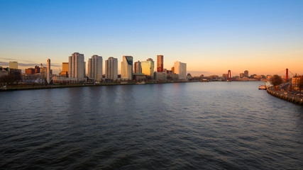 Fototapeta na wymiar Rotterdam skyline and the river Meuse at suset , the Netherlands 