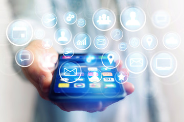 Concept of multimedia icon flying over device on a technology interface - Internet concept