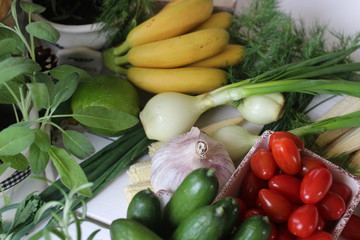 fresh vegetables and herbs, oregano, sage, chive, parsley, dill, onion, cucumber, green vegetables,  red vegetables, red pepper, pepper, garlic, cucumber, sweet corn, 
