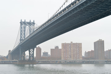 Manhattan Bridge at fog.